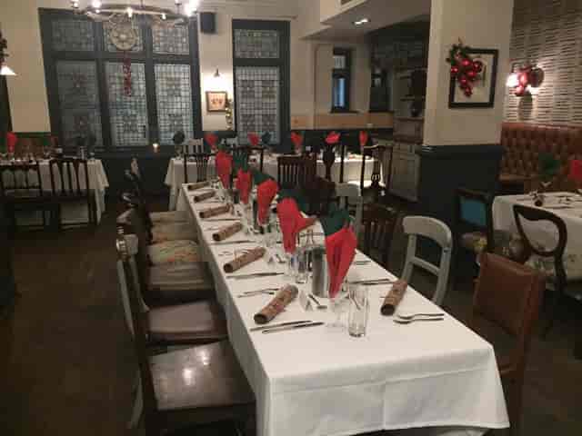 Old Bar festive holiday dining setup with banquet tables for private events.