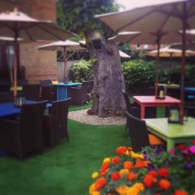 Lounge Garden at The Crown Hotel with colorful breakout seating for networking and conferences.