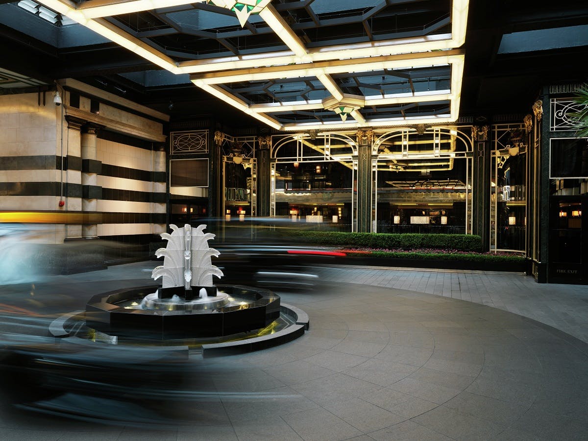 Elegant Savoy Grill venue with striking fountain, ideal for upscale events and meetings.