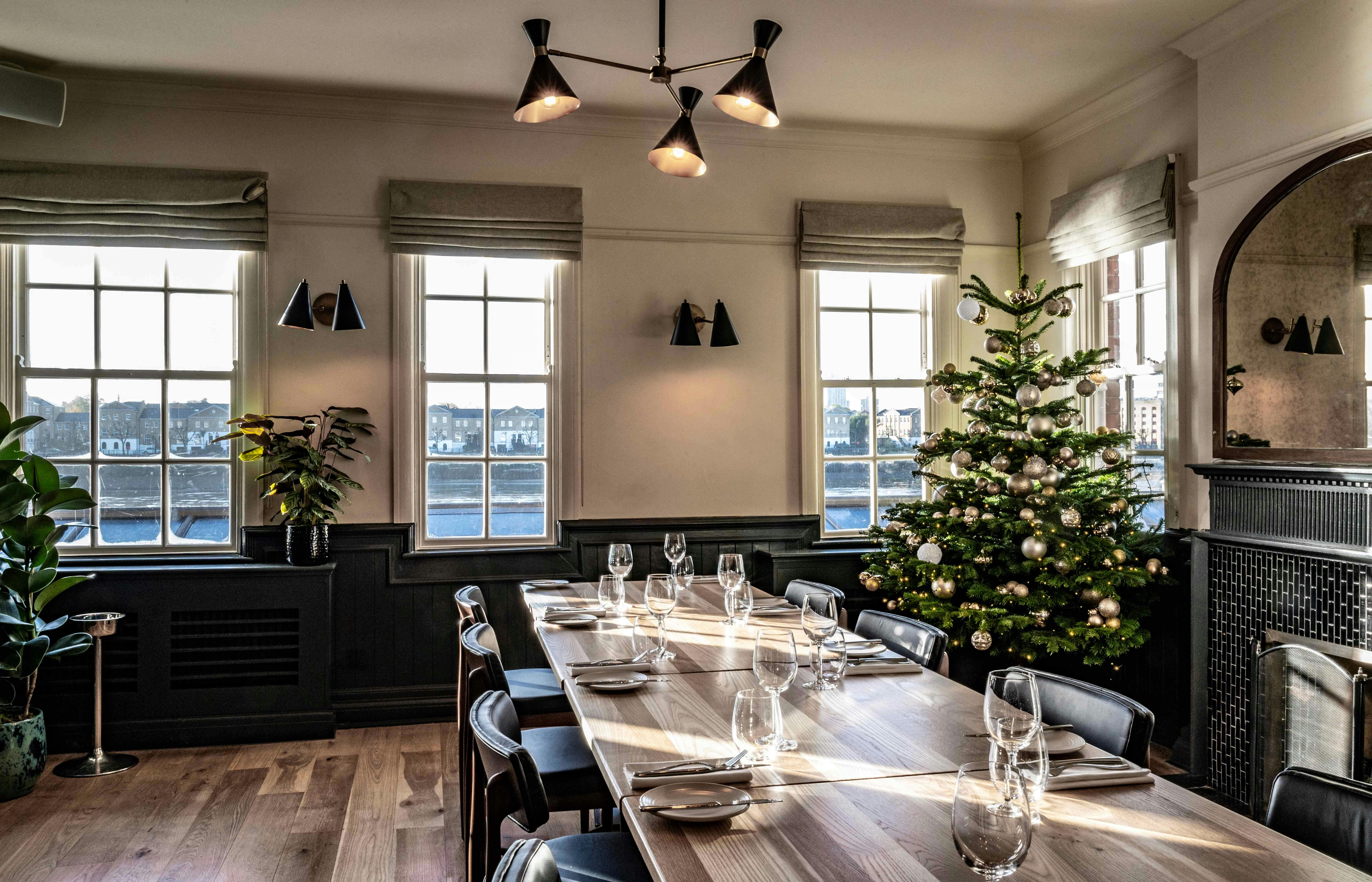 River Room at Bread Street Kitchen with long table, perfect for holiday events and meetings.