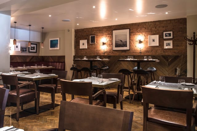 Stylish restaurant setting at Gordon Ramsay Bar and Grill for private dinners and events.
