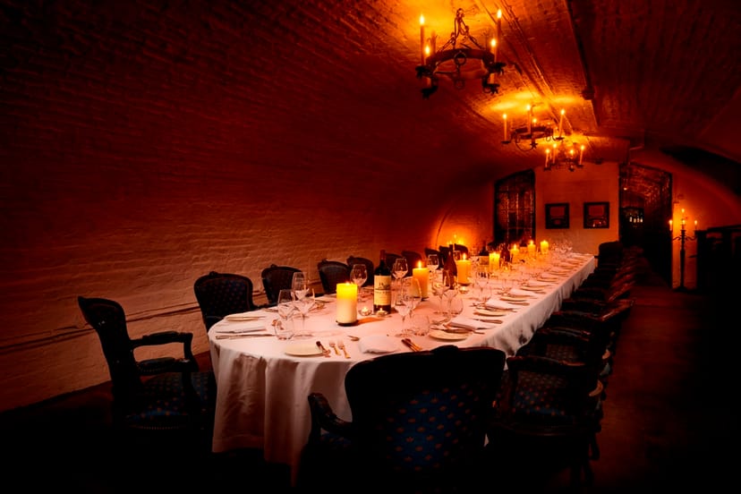 Elegant dining table in The Wine Cellars, perfect for upscale events and intimate gatherings.