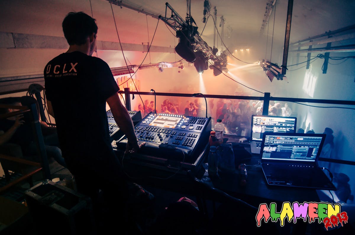 Dynamic audio-visual setup at The Big Black One event with vibrant lights and fog.