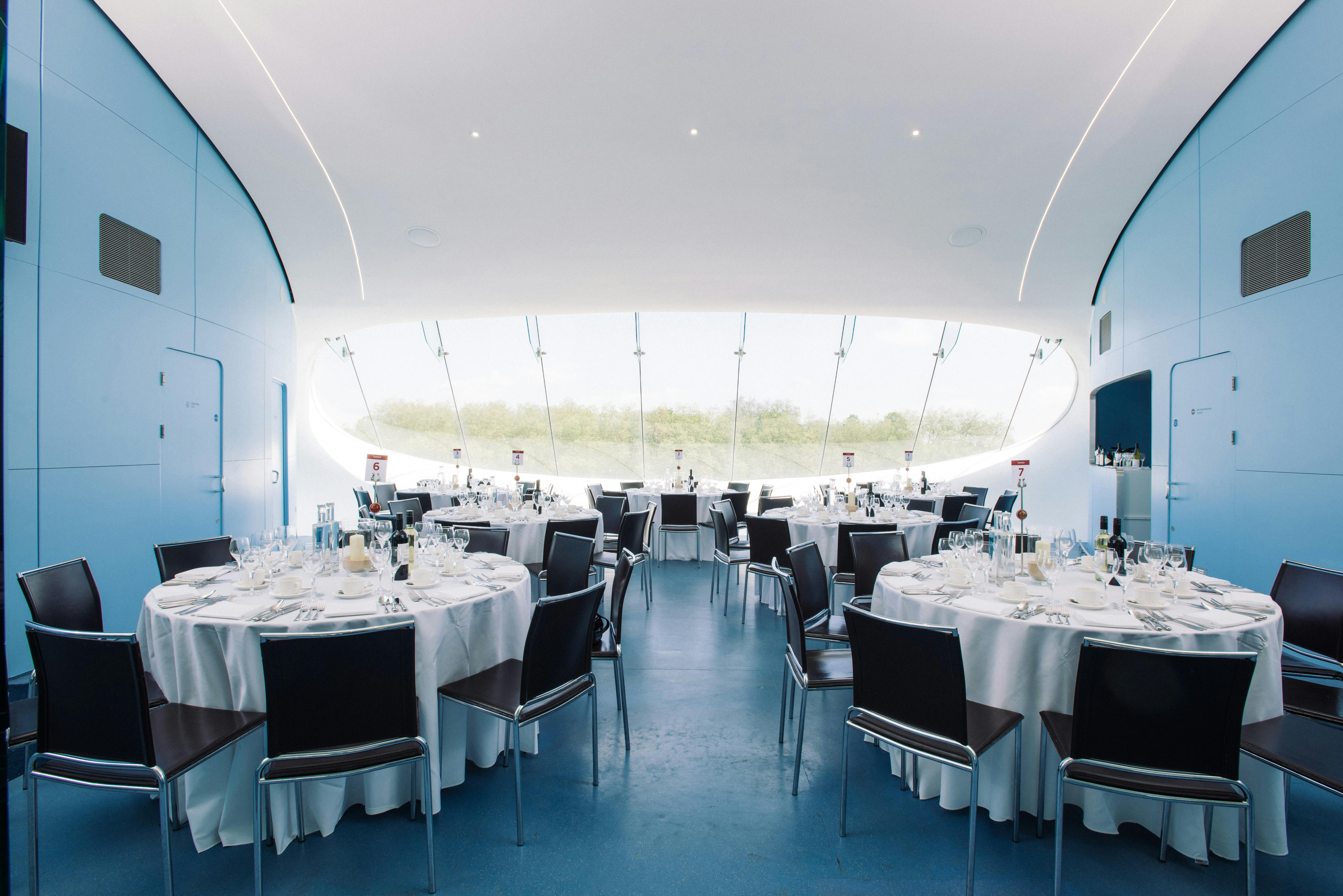 J.P. Morgan Media Centre at Lord's Cricket Ground, elegant event space with round tables.