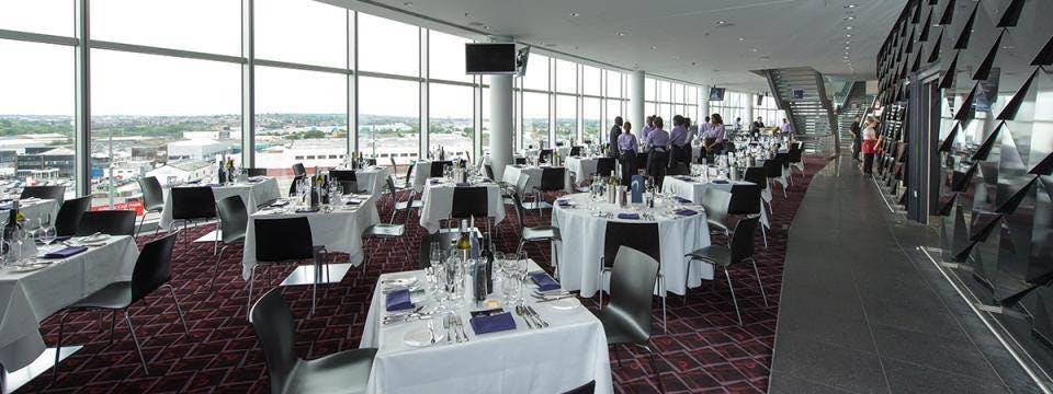 Arc at Wembley Stadium: elegant dining setup for corporate events and upscale celebrations.