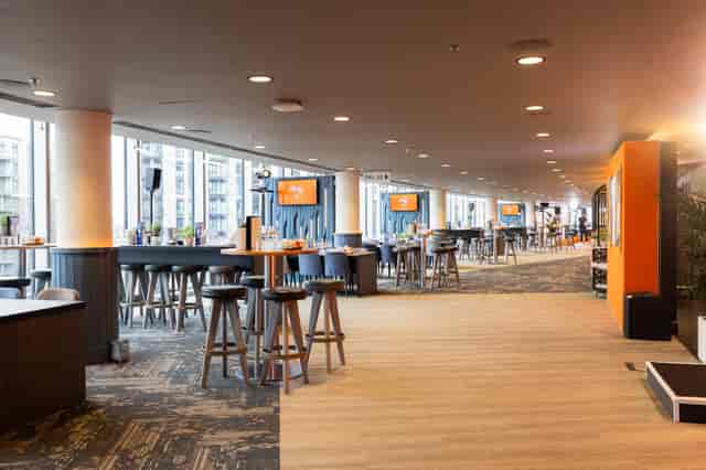 Modern Arc event space at Wembley Stadium for networking and breakout sessions.