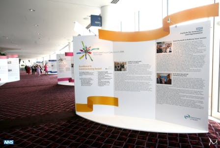 Arc exhibition space at Wembley Stadium with vibrant displays for networking and learning.