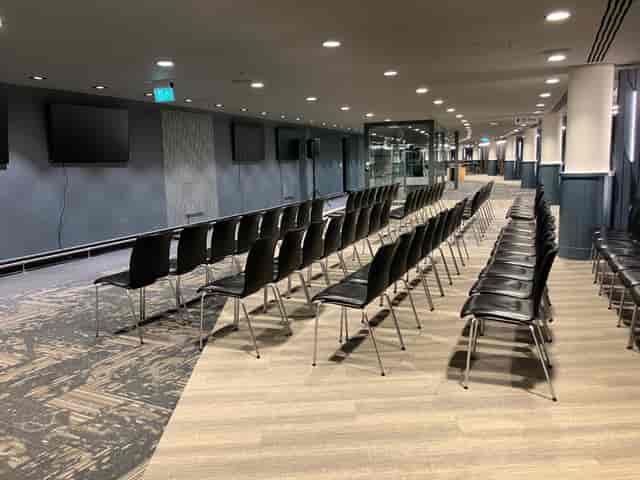 Wembley Stadium theater setup with arched architecture for corporate events and conferences.