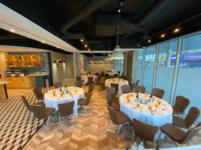 Whitechapel Think Factory event space with round tables, ideal for corporate meetings and workshops.