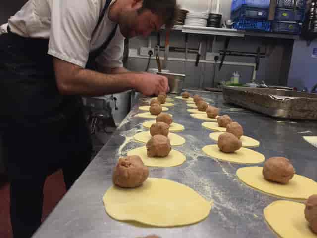 Kitchen team preparing banquet catering at The Shed Notting Hill event venue.