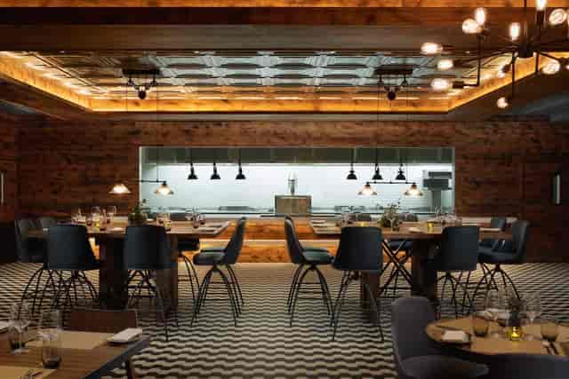 Modern dining space at OXBO Restaurant, ideal for corporate events and gatherings.