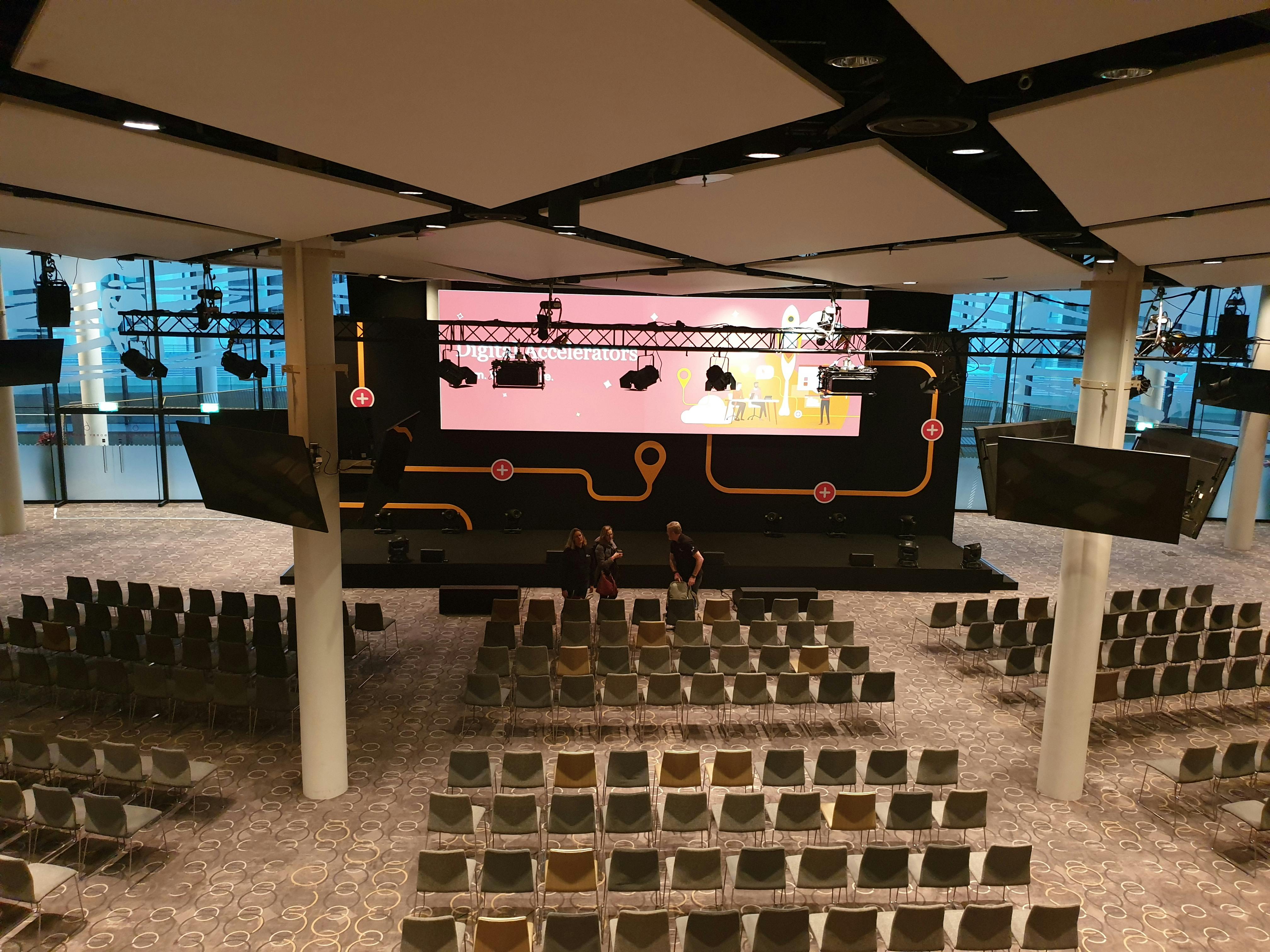 Bobby Moore Room at Wembley Stadium, modern stage for conferences and presentations.