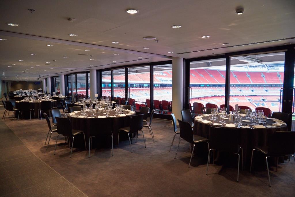 Pitch View Room at Wembley Stadium, elegant tables for corporate meetings and gala dinners. - Banner