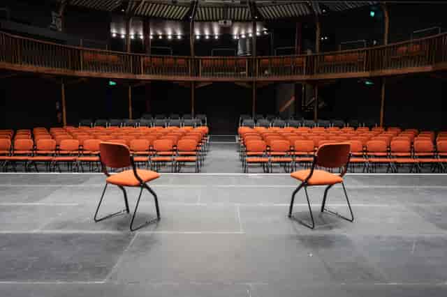 Theatre in The Albany: versatile event space with stage for engaging discussions and performances.