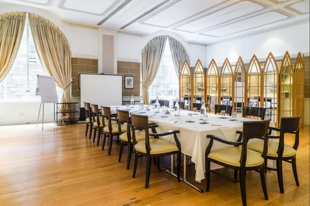 Corporate meeting room in The Scotsman Hotel, featuring a long table and elegant decor.