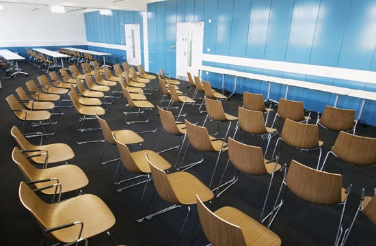 Bloom Suite meeting space with modern chairs, ideal for presentations and workshops.