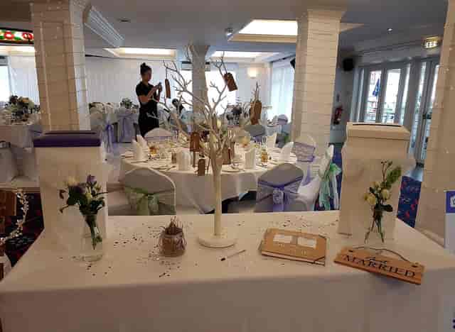 Elegant Spinnaker Function Suite with white and purple decor for events.