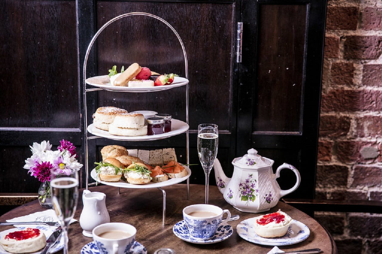 Afternoon tea setup with pastries at Crusting Pipe, ideal for networking events.