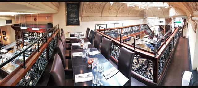 Elegant dining space with balcony view, ideal for exclusive events in Browns Mayfair.