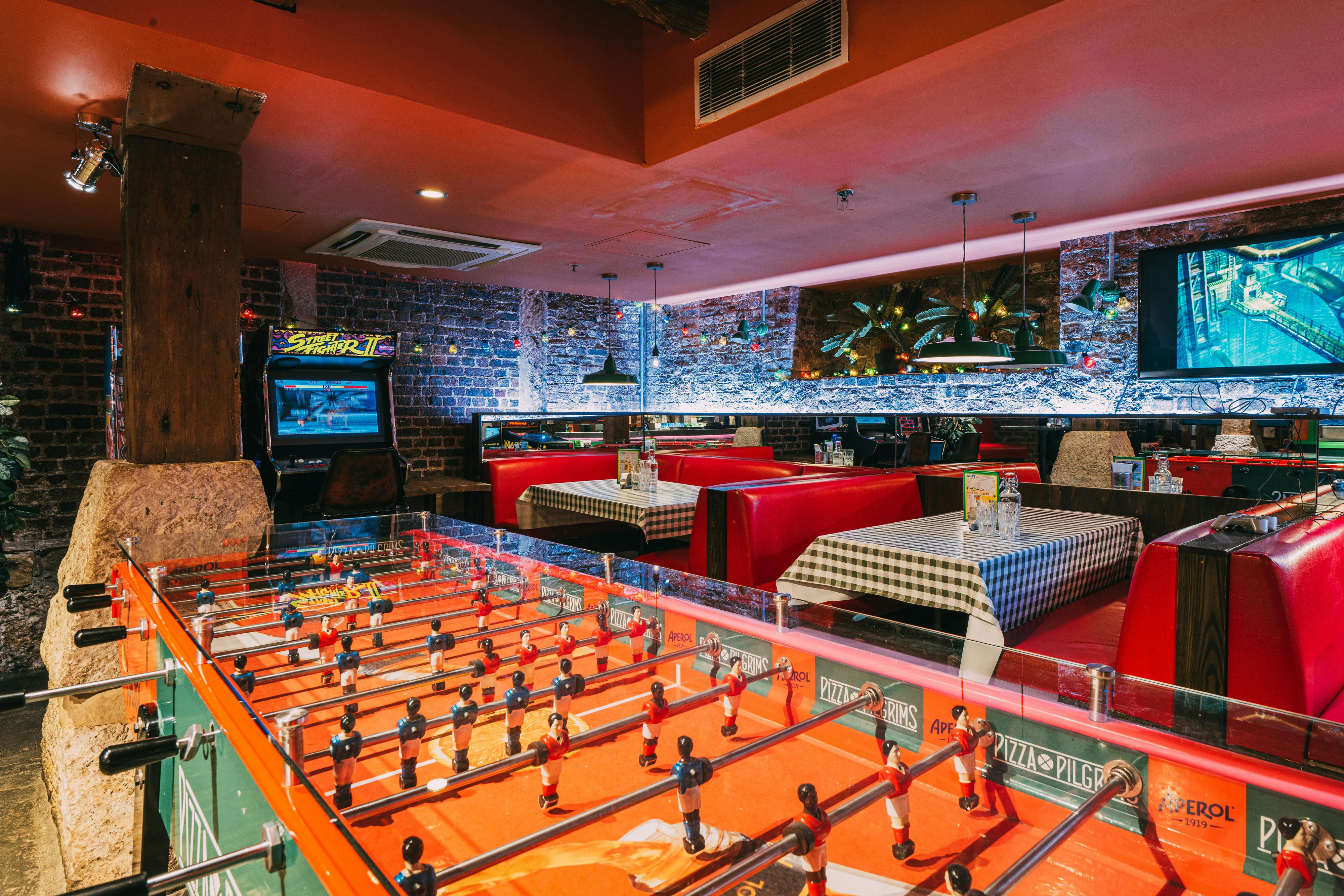 Vibrant Pizza Playground venue with retro decor for team-building events and gatherings.