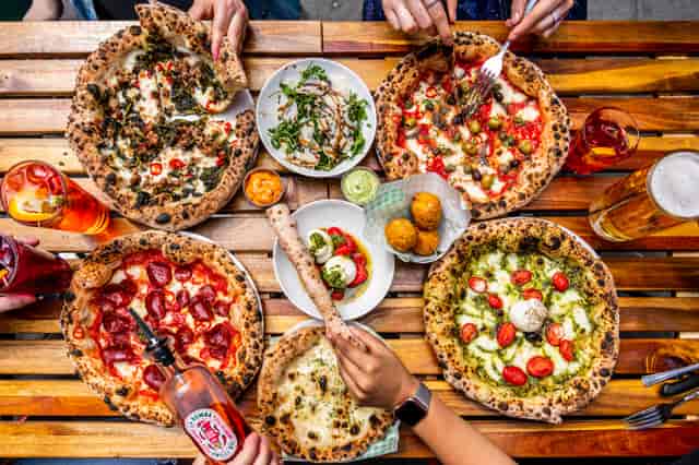 Gourmet pizzas at The Pizza Playground for casual networking events and team-building.