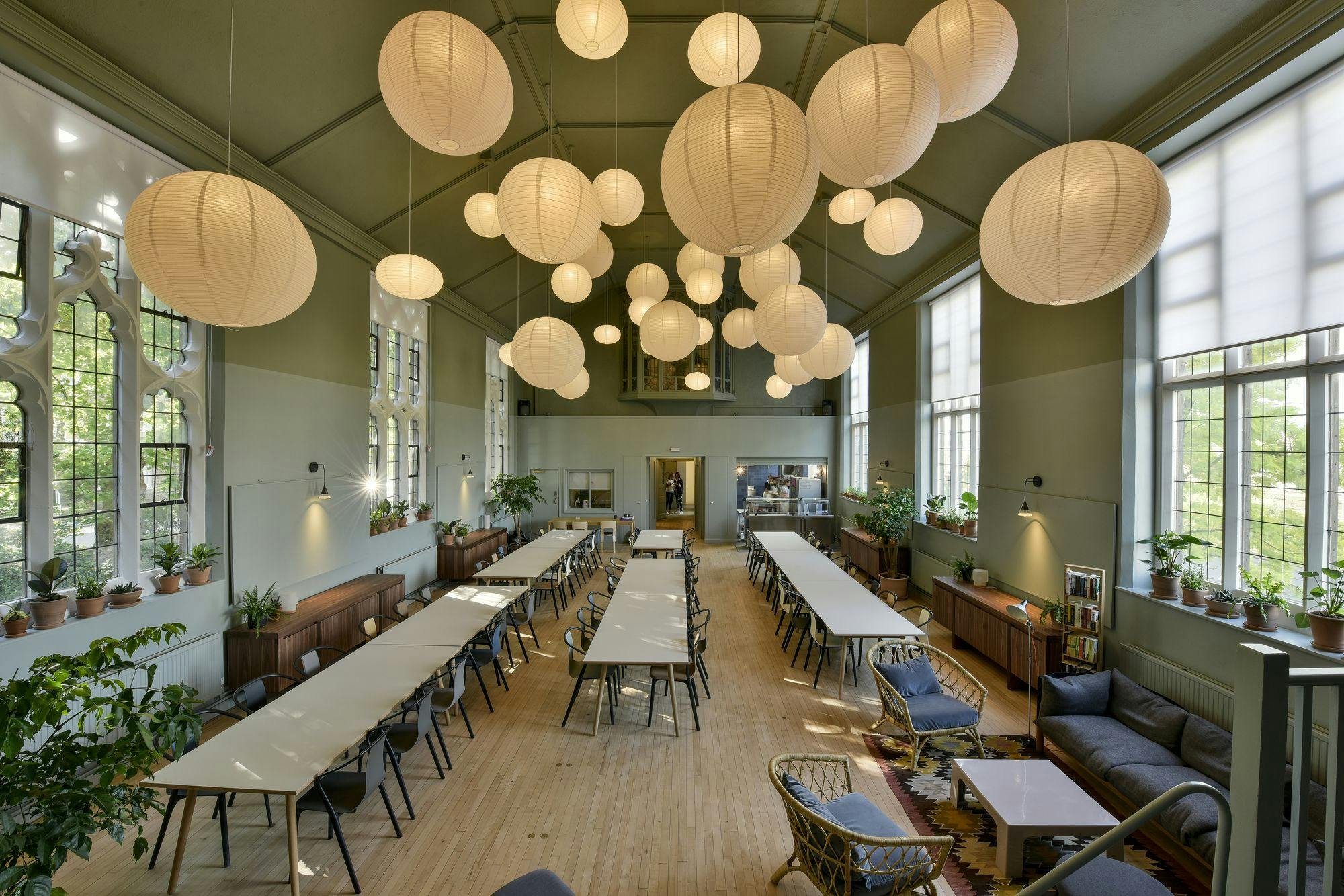 Spacious event venue with long tables, ideal for workshops and networking at Refettorio Felix.