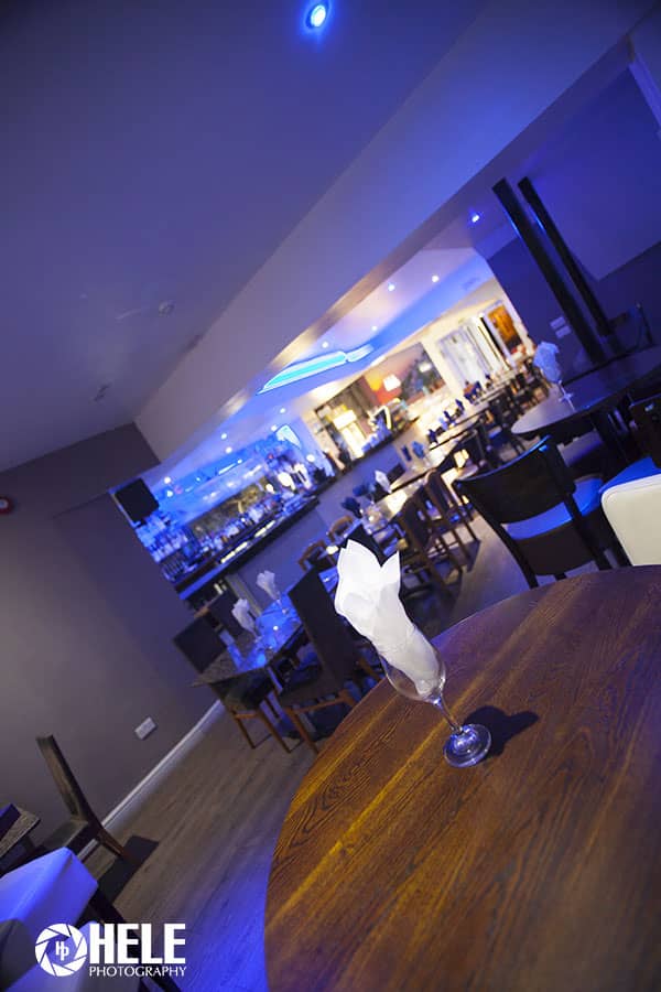 Modern event space in Santorini Restaurant with sleek bar, perfect for gatherings and networking.