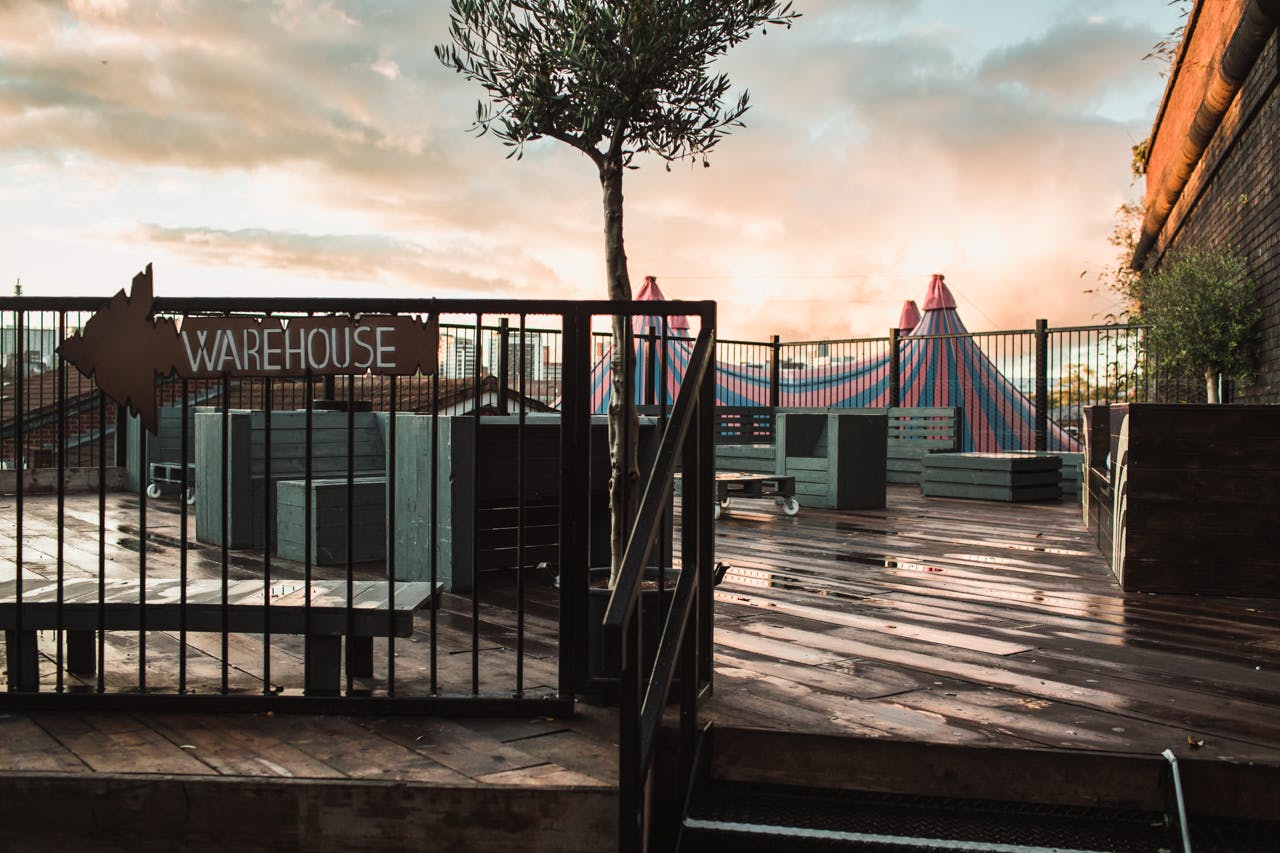 Roof Terrace at The Rainbow Venues: modern outdoor event space with colorful tents.