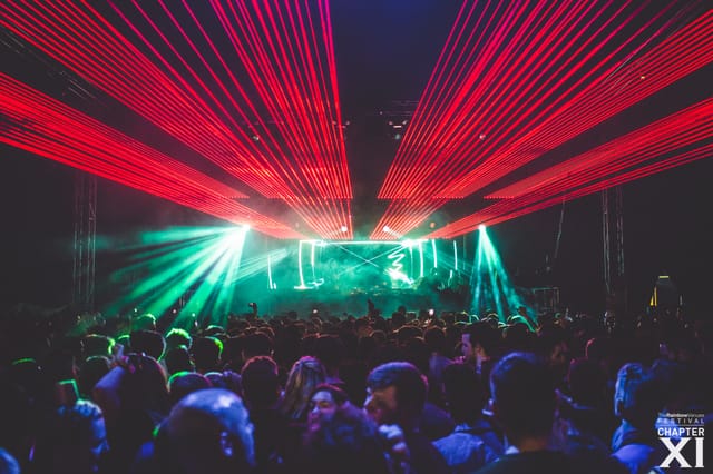 Vibrant concert atmosphere at The Rainbow Venues with dynamic lighting and engaged crowd.