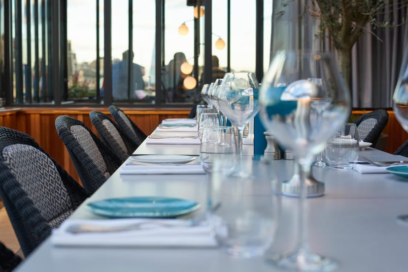 Elegant Rooftop event space with table setting for upscale dinner in London.