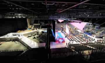 Upper Level ACC Liverpool conference space with tiered seating and stage setup.