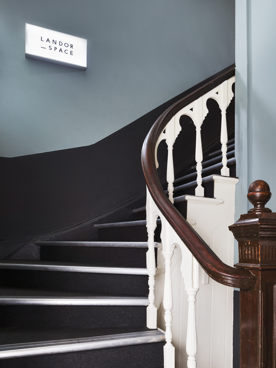 Elegant wooden staircase in Landor Space, perfect for networking events and gatherings. - Banner