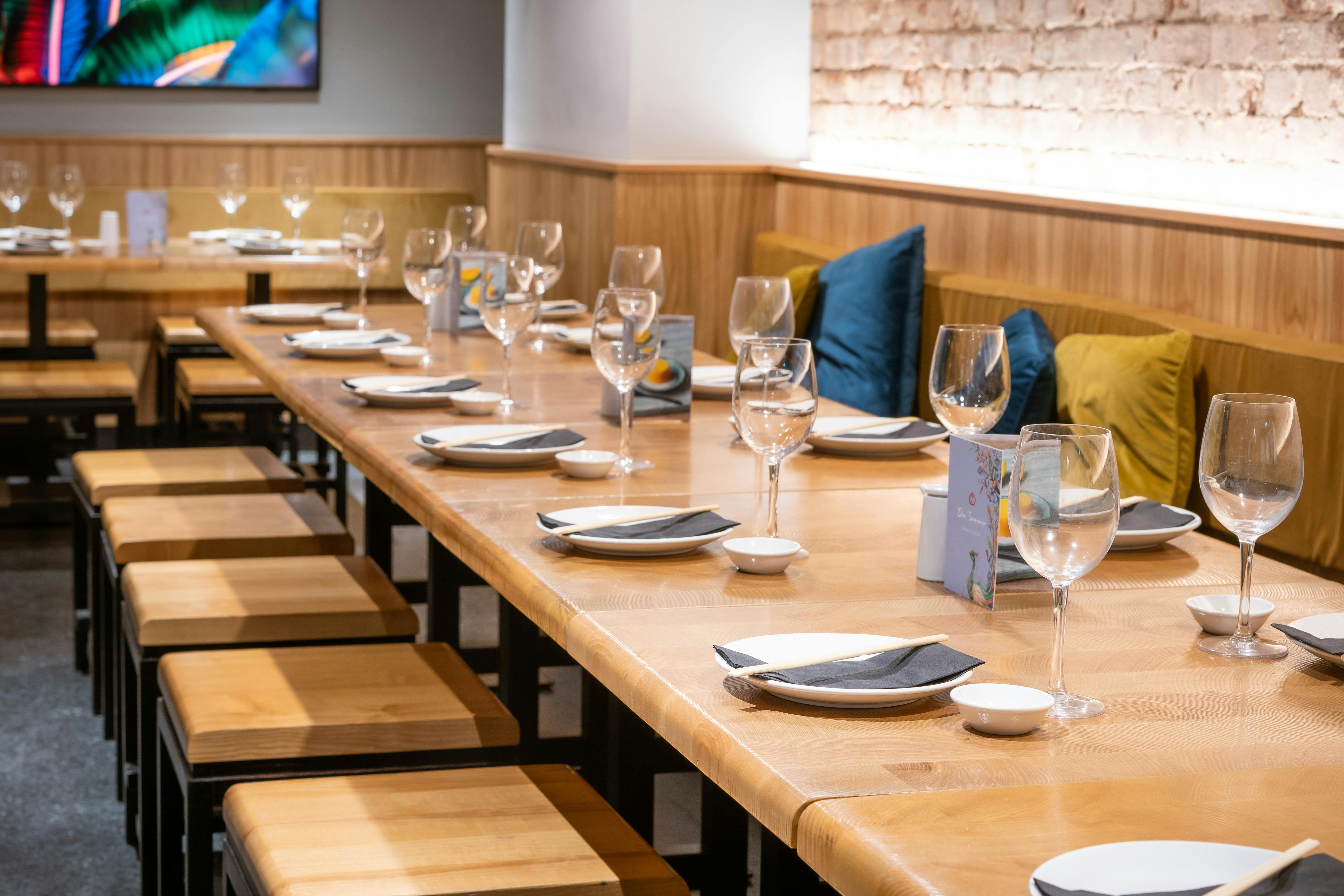Private dining setup with elegant tableware for corporate dinner or networking event.