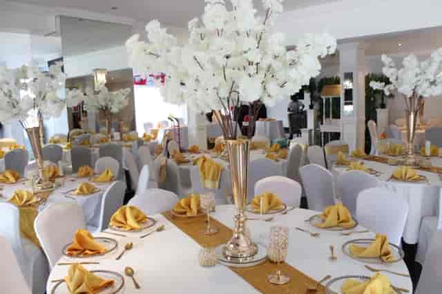 Elegant dining area with floral centerpieces for corporate events and gatherings.