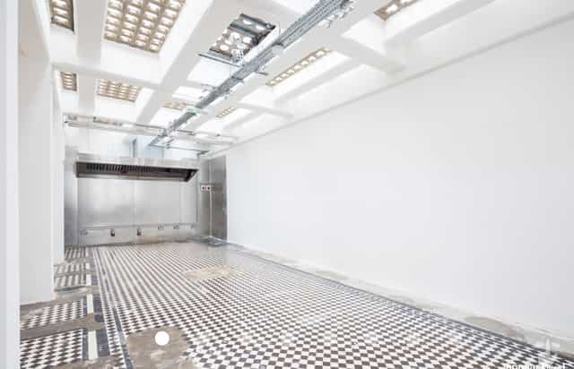 Versatile event space in Abracadabra Hub with polished checkered floor for corporate meetings.