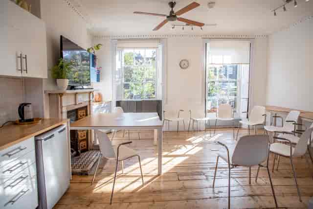 Bright meeting space with large windows, ideal for workshops and team gatherings.