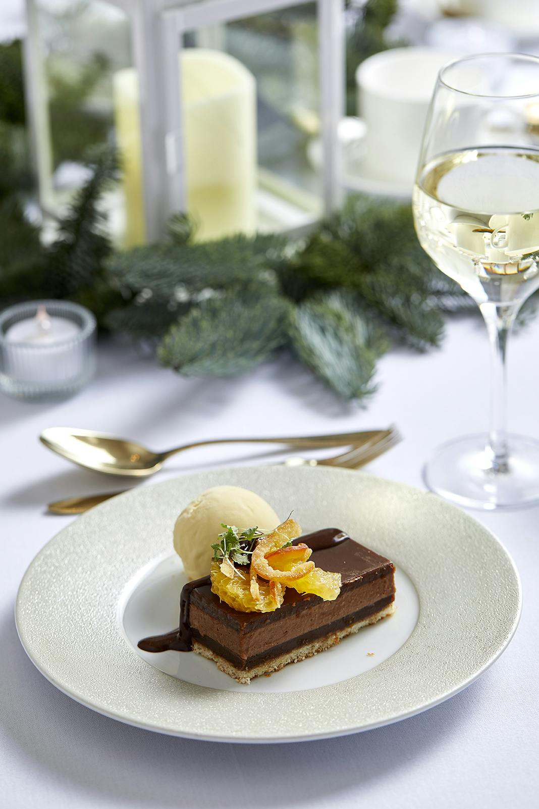 Elegant chocolate dessert with vanilla ice cream for upscale Christmas events.