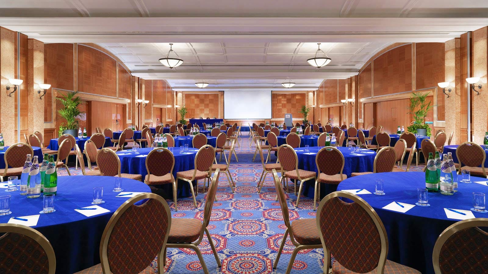 International Suite at Sheraton Skyline Hotel, blue-draped tables for conferences and banquets.