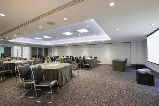 Meeting room at Leonardo Royal Hotel London, featuring flexible seating for corporate events.