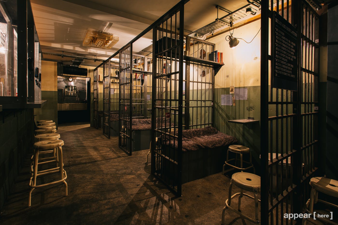 Alcotraz Prison Cocktail Bar: vintage jail-themed event space with metal bars.