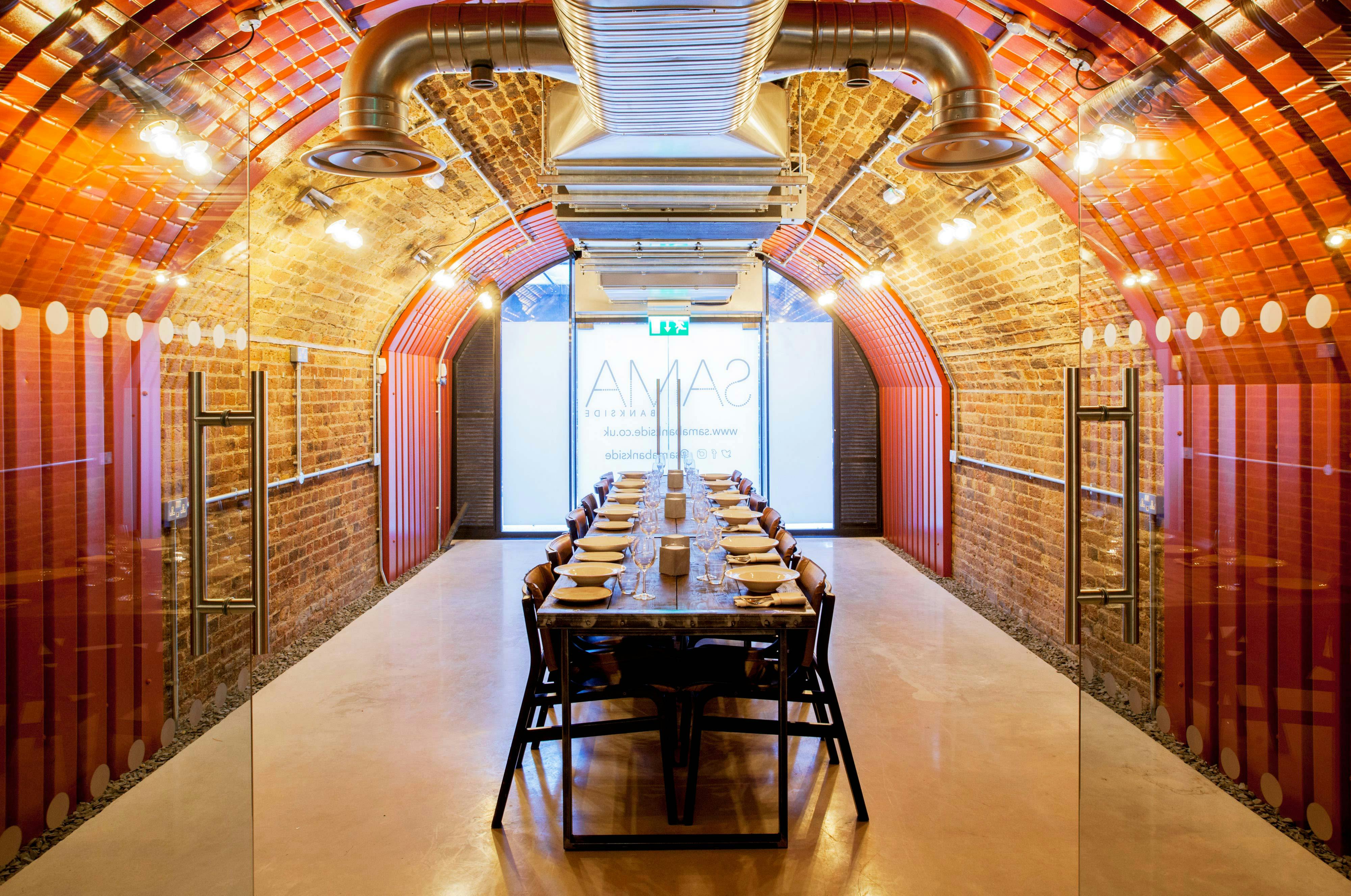 Stylish meeting room with exposed brick, ideal for corporate events and brainstorming sessions.