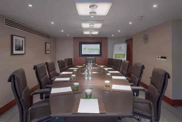 Executive Boardroom at Holiday Inn Kensington, featuring a long table for corporate meetings.
