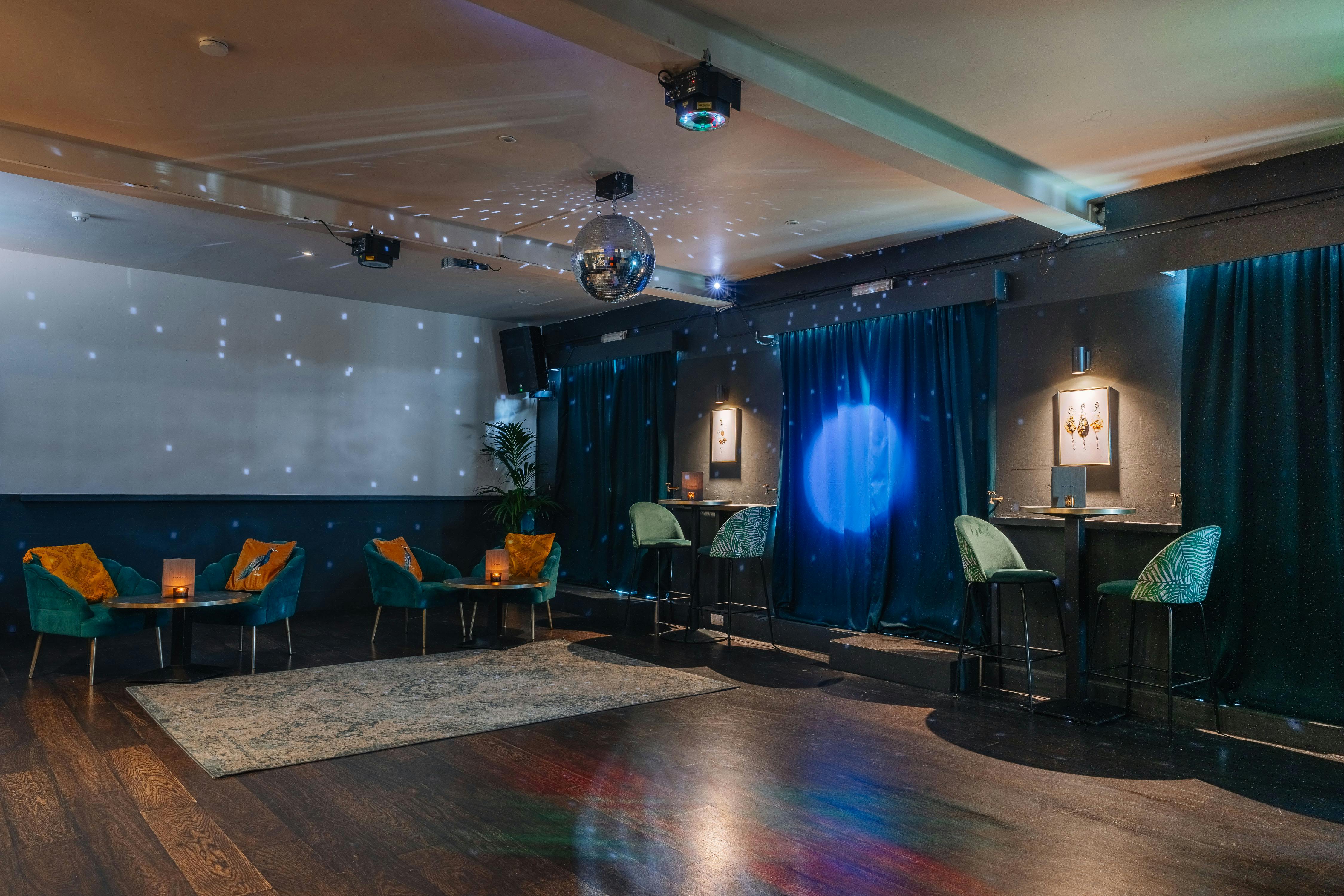 Stylish event space with disco ball, ideal for networking and small celebrations.