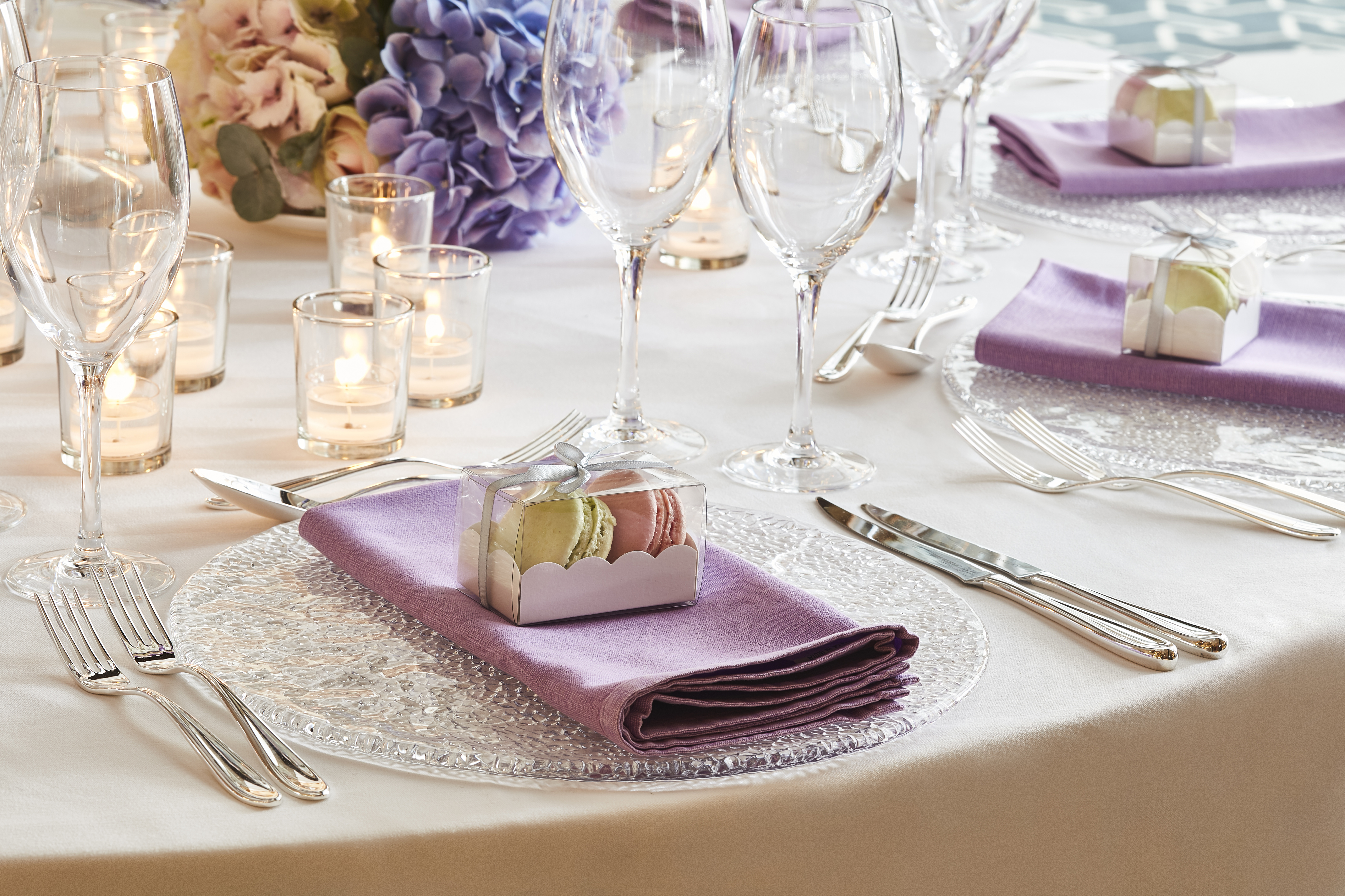 Elegant dining table with lavender napkins for weddings and upscale events. - Banner
