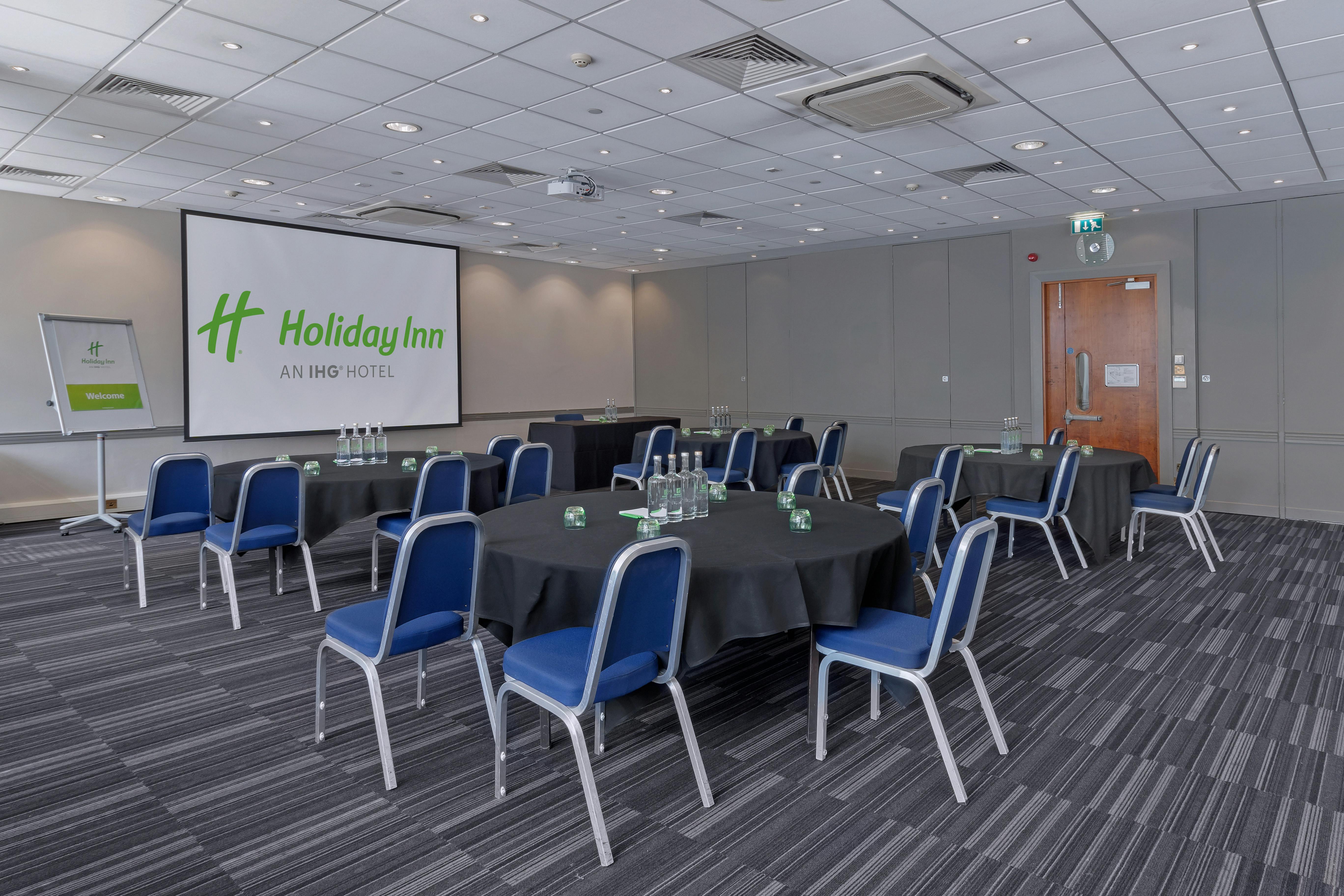 Dylan in a modern meeting space at Holiday Inn Kensington, perfect for corporate events.