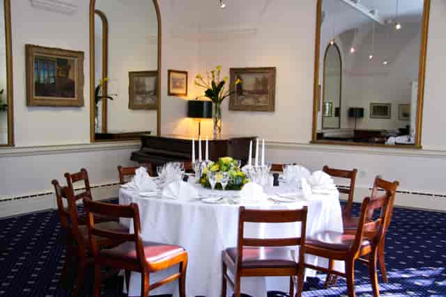 Elegant dining setup in The Solar Room & Garden for corporate events and gatherings.