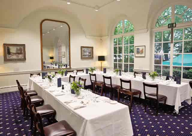 Elegant dining setup in The Solar Room & Garden for corporate dinners and networking events.