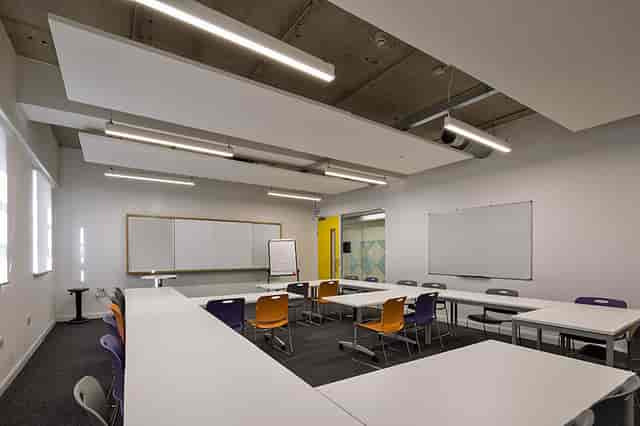 Ground floor classroom with modular tables for workshops at Ada National College.