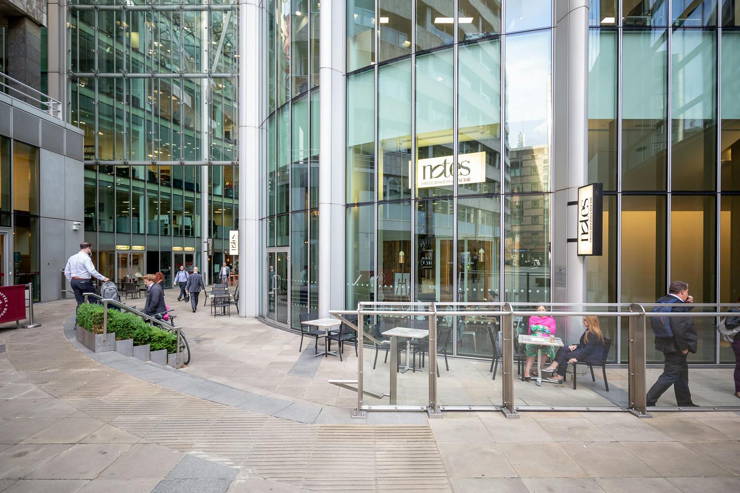 Modern urban venue with glass facades, perfect for corporate events and networking.