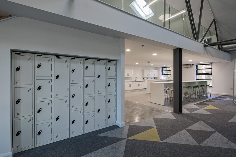 Modern open space with kitchenette for meetings and events at Ada National College.